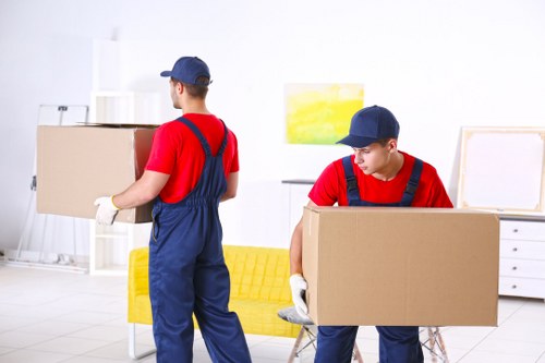 Professional movers using safety procedures during relocation