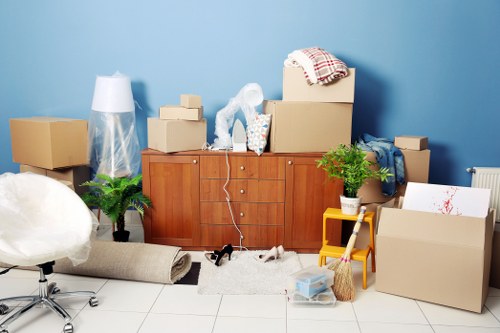 Removals van service in Canary Wharf near modern high-rise apartments