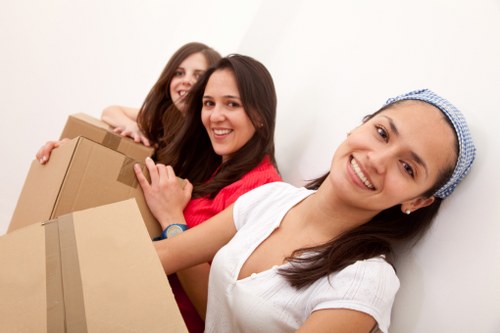 Packed boxes and furniture ready for local removals in Canary Wharf