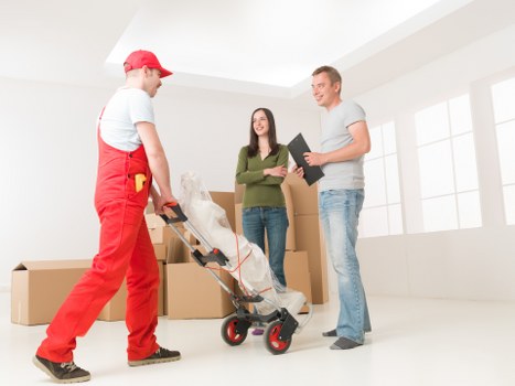 Professional movers transporting items during a relocation