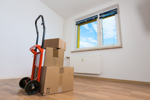 Careful unpacking and room setup in a Canary Wharf property