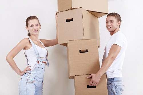 Local removals team handling a move in a Canary Wharf high-rise building